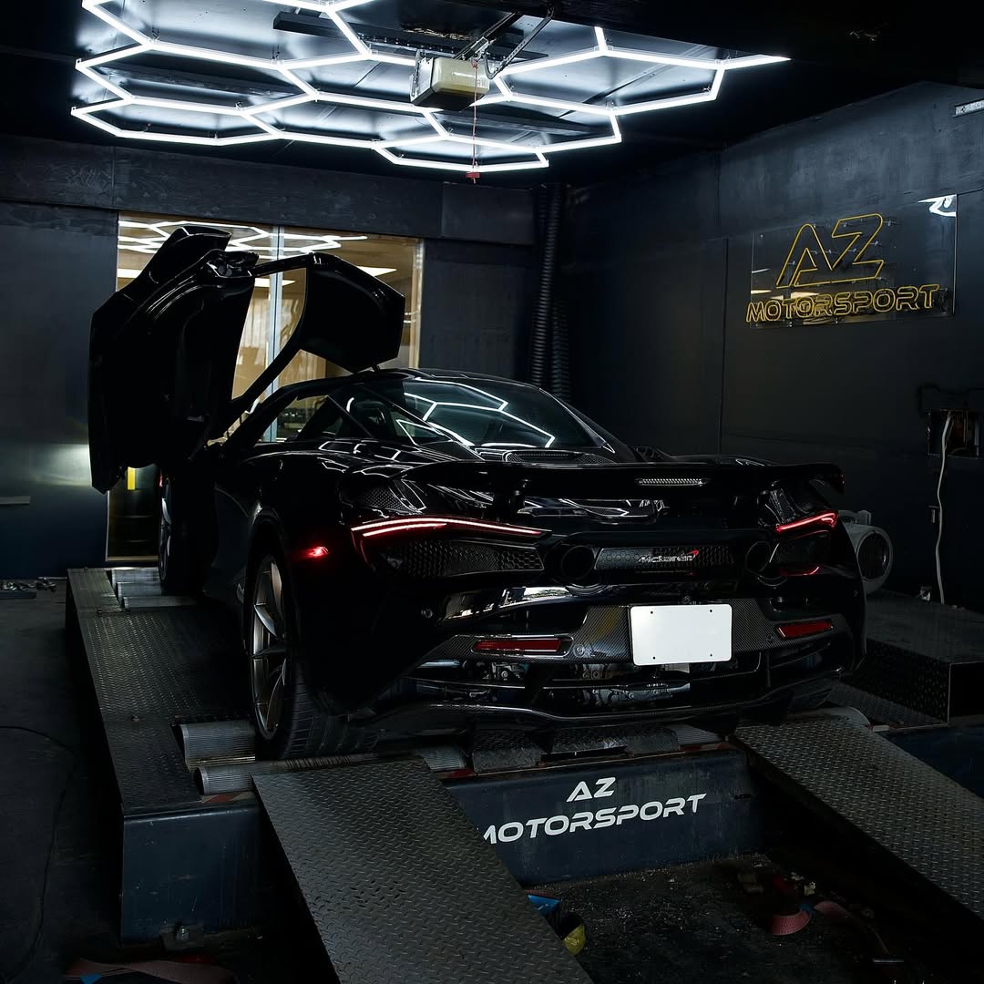 Black McLaren 720S on the dyno, dihedral door up