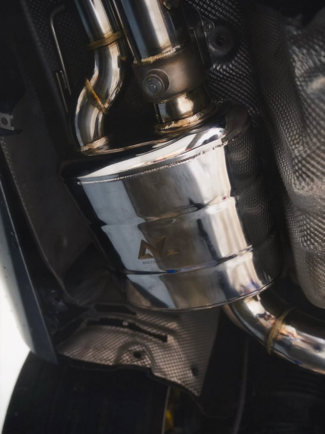 Polished AZ Motorsport stainless downpipe close-up